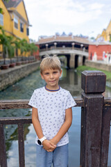 Happy european family, visting Hoi An city in Vietnam for a summer vacation, trying traditional food na watching the show in Memories Land