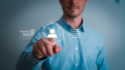 Man selects profile icon on futuristic digital interface, signifying data management and user engagement.