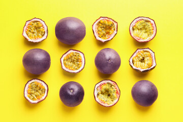 Fresh passion fruits on yellow background, flat lay