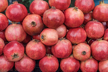 Bunch of pomegranates pictures directly above.
Attractive red fruit with many antioxidant properties.
