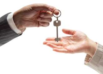 Hand of man in formal suit giving keys to woman's hand on isolated background. Concept of sale of real estate, rent of housing