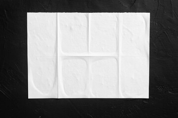 White city poster on black wall.