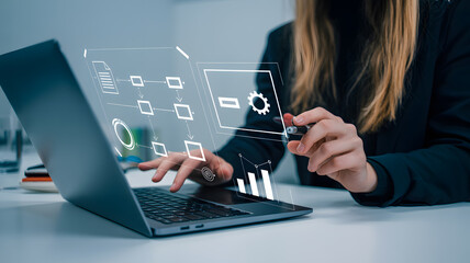 Professional woman analyzes data flow charts and business metrics on laptop screen