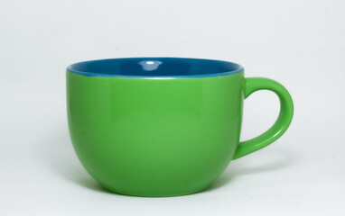 Taza de cafe verde con azul