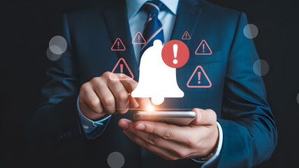 Businessman receiving urgent alerts on smartphone, digital notification system for critical warnings