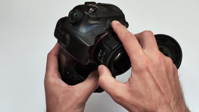 changing the lens on a camera