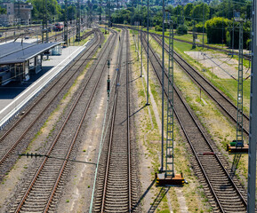 Steel rails shimmer under the noon sun, guiding the eye through Heilbronn’s central station.