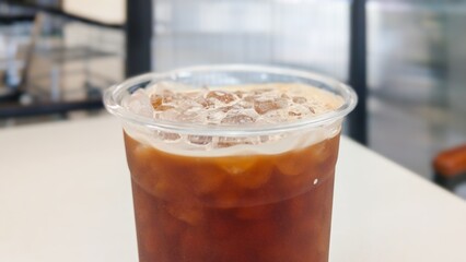 A cup of iced coffee on a table