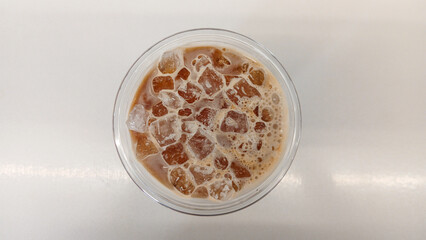 A cup of iced coffee on a table