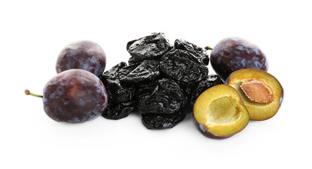 Dried prunes and fresh plums isolated on white