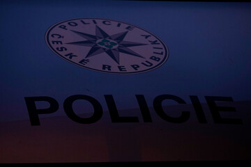 Police car logo with bold inscription symbolizes authority, law enforcement, public safety, and official security presence in urban environment © VladyslavShcherbakov