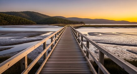 Fototapeta premium Wooden bridge sunset coastal view.