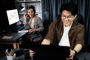 Smiling businesswoman trader with partner discussing on stock market trading exchange in casual...