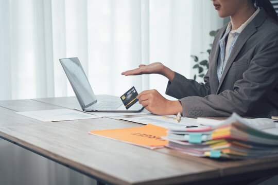 Online Transaction: A focused professional engaging in an online transaction, highlighting modern digital payment systems and business efficiency.