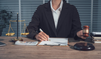 Legal Professional at Work: A poised legal professional in a formal suit concentrates on legal...