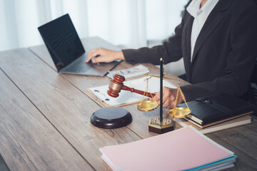 Judge gavel with Justice lawyers, Businessman in suit or lawyer working on a documents. Legal law, advice and justice concept.