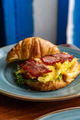 Breakfast on a Blue Plate – Toast with Bacon, Cheese, Lettuce and Bread