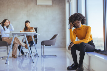 Pensive Woman Sitting By Window During Stressful Business Meeting