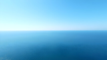 Obraz premium Serene turquoise horizon with a calm ocean under a clear blue sky vista