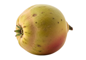 A vibrant quince fruit, displaying a textured skin of pale yellow and hints of rosy red, against a stark black background.