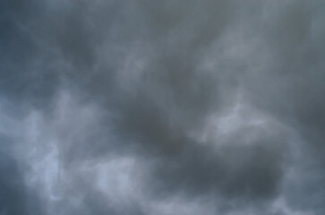 Gray stormy sky with dramatic clouds creating natural atmospheric background for weather, climate, and moody nature concepts