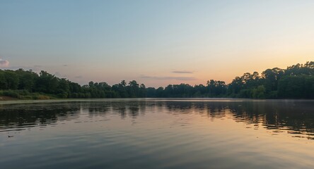 Fototapeta premium Tranquil Waters, Green Horizons. A Quiet Lakeside Scene at the Break of Dawn.