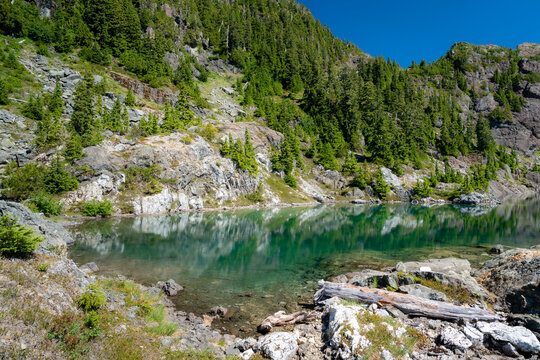 A clear blue lake on the top of Ursus mountain on Vancouver Island, Canada