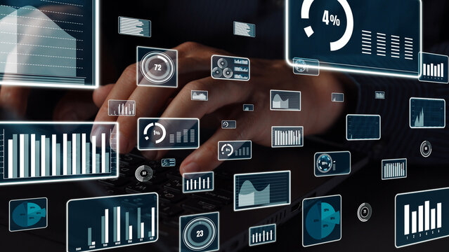 A close-up image of hands typing on a laptop with overlaying digital data and graphs, showcasing the modern integration of technology in business analytics and performance tracking. Xenic