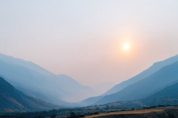 Naklejka premium Calm landscape features soft blue mountains under hazy sunset gl