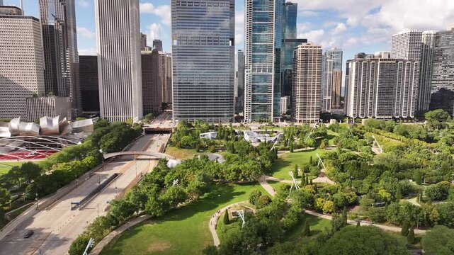  Aerial Drone View of Maggie Daley Park and Chicago Skyline, Illinois&rdquo;. Stunning aerial drone footage of Maggie Daley Park in downtown Chicago, Illinois, showcasing lush green landscapes, winding walk