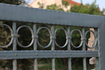 Metal curly fence in the park