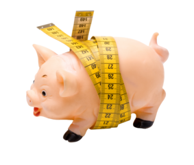 Piggy bank wrapped with measuring tape on transparent background