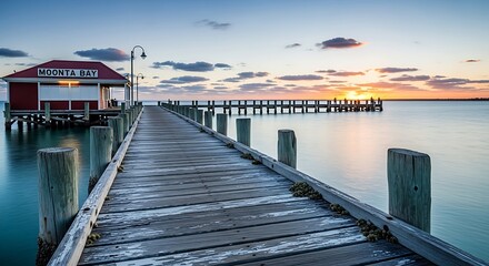 Sunset Pier with Calm Water, and Coastal Scene.