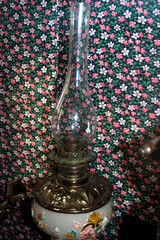 vintage oil lamp on the background of a patterned tablecloth