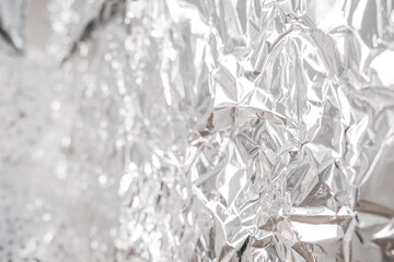 A silver foil is shown in a close up