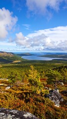 Panoramic view of autumnal mountains and a lake