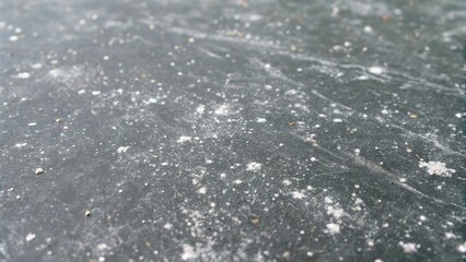 Detailed closeup of a dusty black surface, revealing intricate patterns and textures, perfect for abstract backgrounds and industrial design projects
