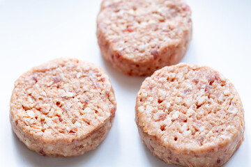 Three Plant-Based Meatballs on a White Plate