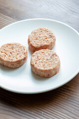 Three Plant-Based Meatballs on a White Plate
