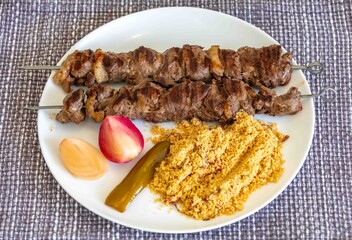 Typical Brazilian barbecue skewer made with filet mignon, a traditional happy hour snack. Espetinho, churrasquinho