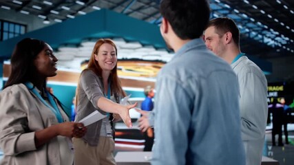 Shaking Hands At Trade Fair With Diverse Team - Powered by Adobe