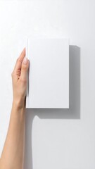 Fototapeta premium Hand holding blank white book