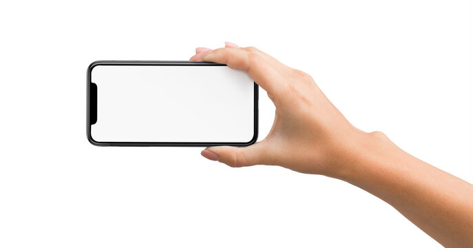 Woman hand holding smartphone with blank screen in horizontal orientation, isolated on white background - Powered by Adobe