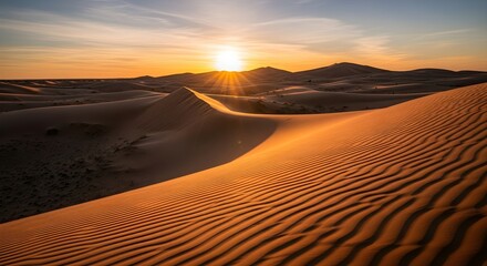 Golden sand dunes at sunset, rippling patterns, desert landscape, warm light, vast expanse