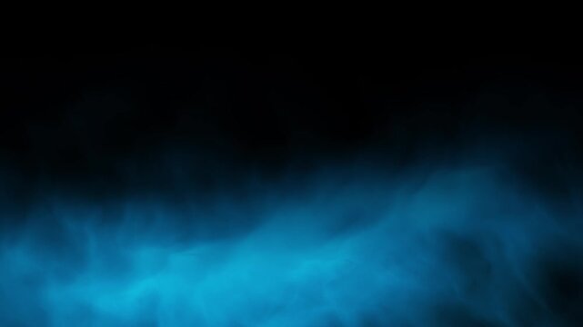 Thick blue smoke on a black background. blue mist fog. Smoke and fire.