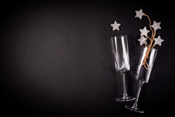 Two glasses with wooden tar decoraion with rope, flat lay, celebration concept