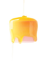 Glass cosmetic jar with honey dripping on white background