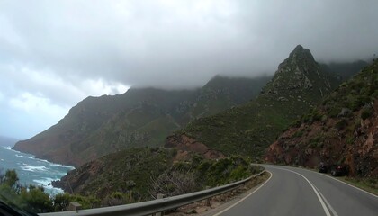 Winding coastal road through lush mountains