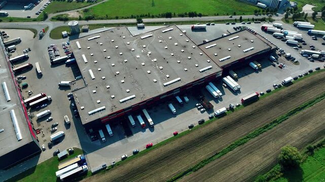 Efficient logistics center with trucks loading and unloading goods