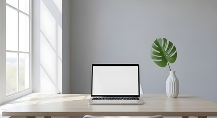 Modern laptop on clean wooden desk bathed in natural light, perfect for remote work